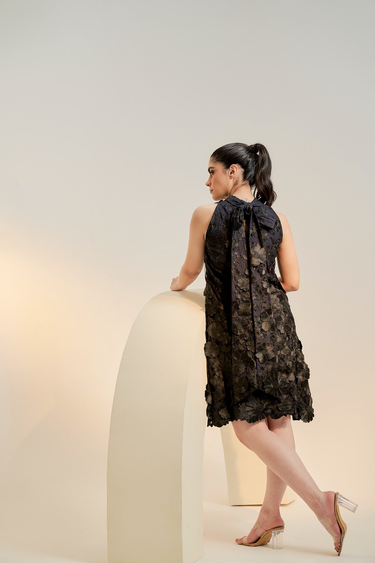 Black embroidered cocktail dress with tie detail
