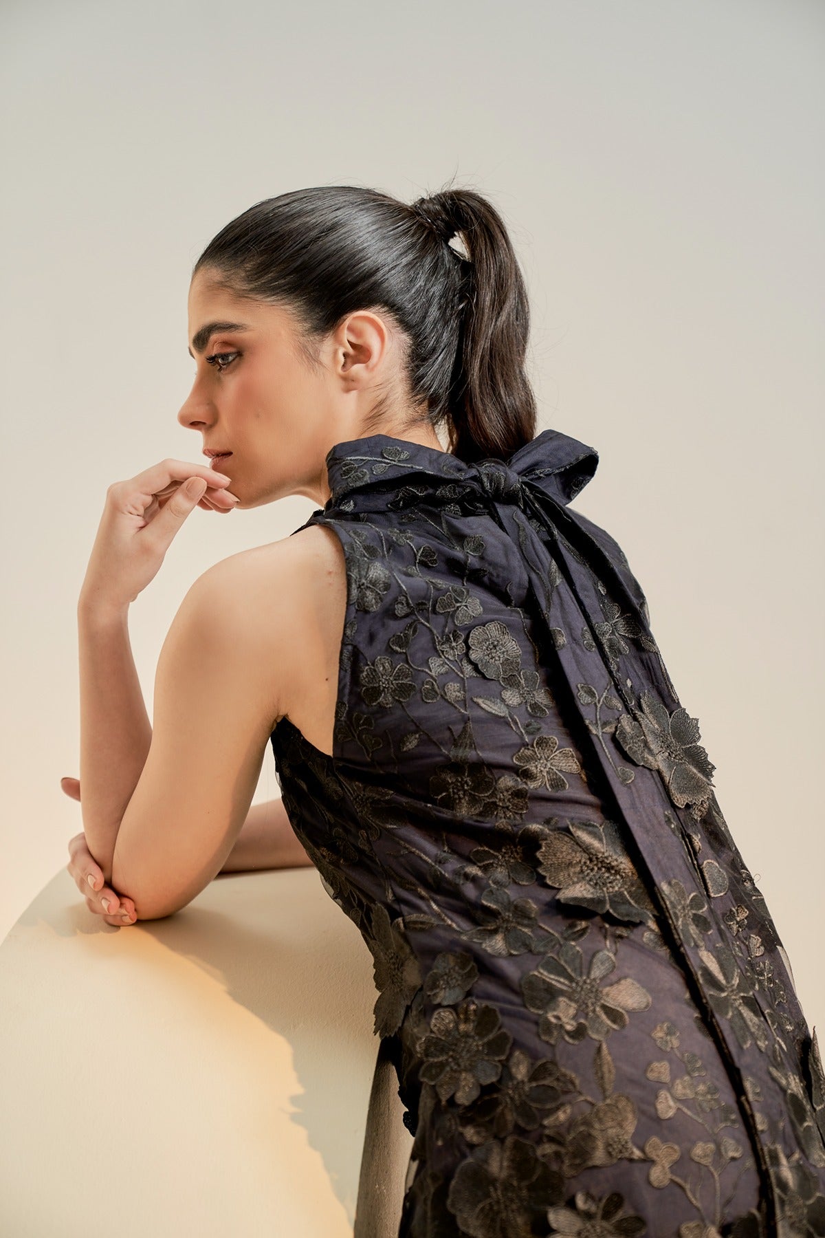 Black embroidered cocktail dress with tie detail